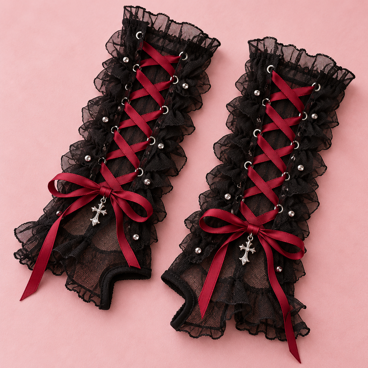 Close-up of crimson ribbon lacing on black mesh arm warmers