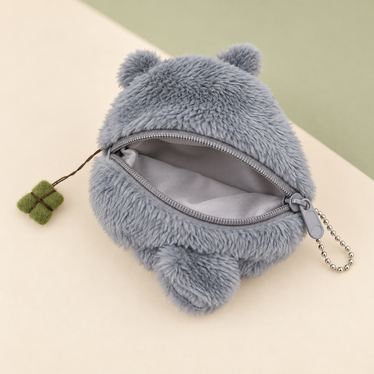 Open Totoro plush keychain wallet showing zipper and lining
