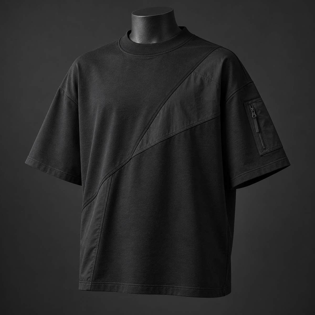 Oversized black techwear t-shirt with diagonal panel and sleeve zip pocket