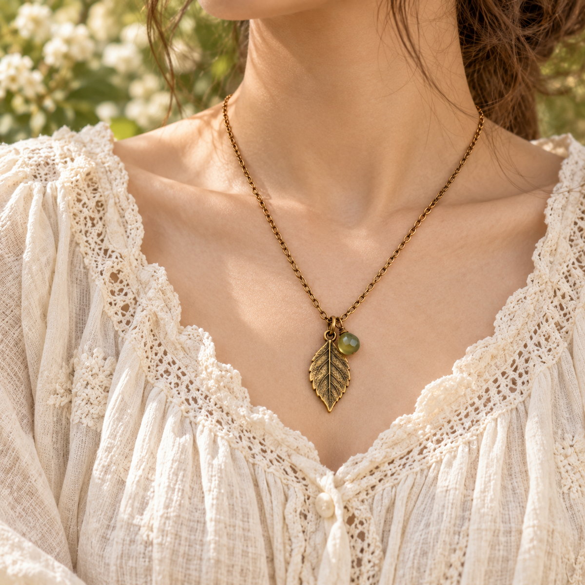 Leaf pendant necklace styled over a cream Mori Kei blouse