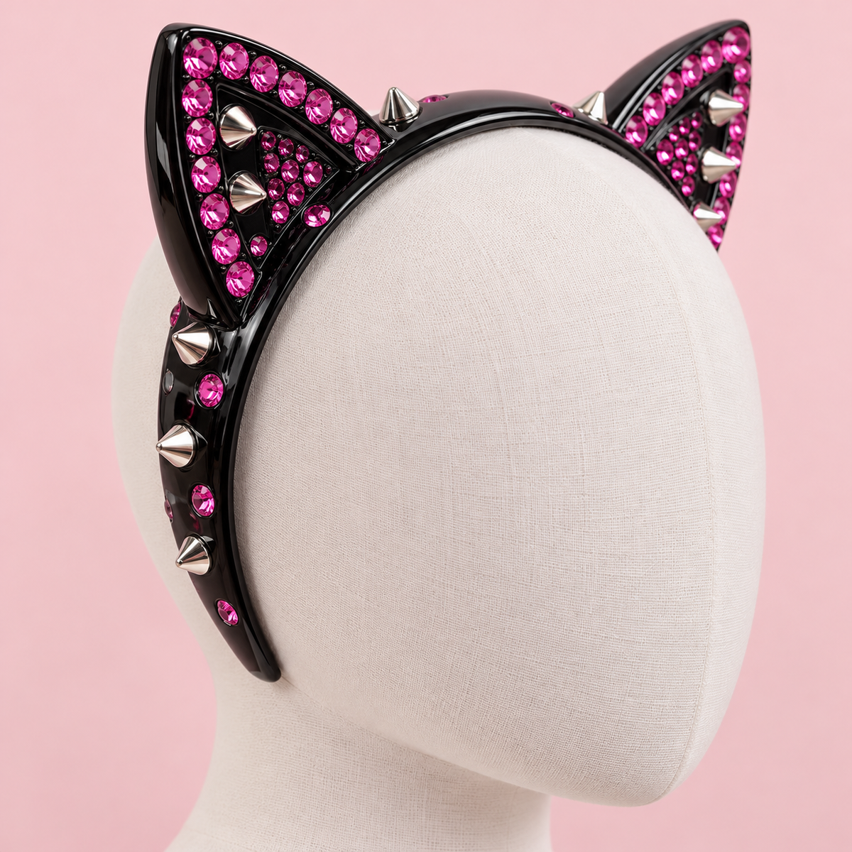 Three-quarter detail of pink rhinestones and silver studs on the black Gyaru cat-ear headband
