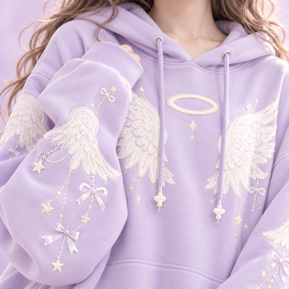 Close-up of the white angel wing embroidery on the lavender Tenshi hoodie
