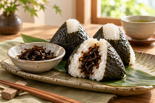 Kombu onigiri cut open with glossy kelp filling and nori