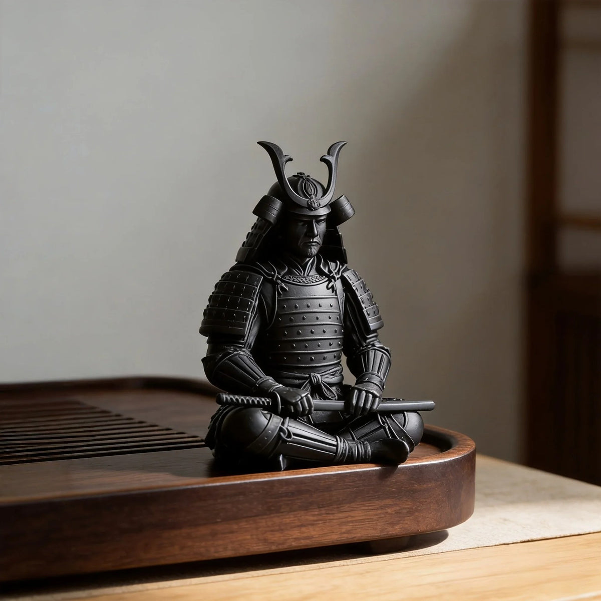 Zen sitting samurai figure in a Japanese rock garden with bamboo