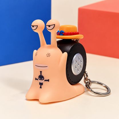 Ace Den Den Mushi keychain photographed from a distinct front three-quarter angle