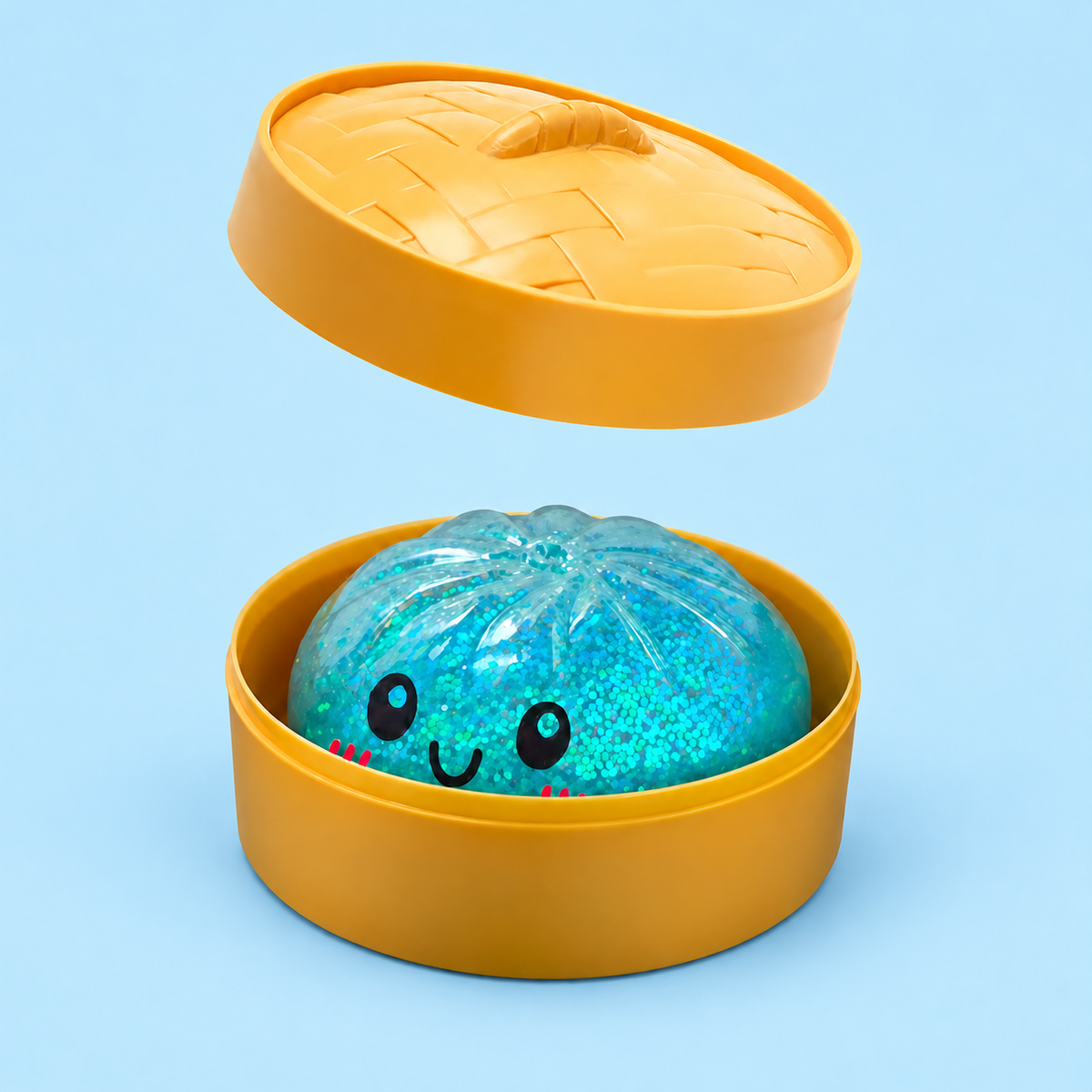 Blue Glitter Dumpling Squishy in its case on a plain powder blue pastel background