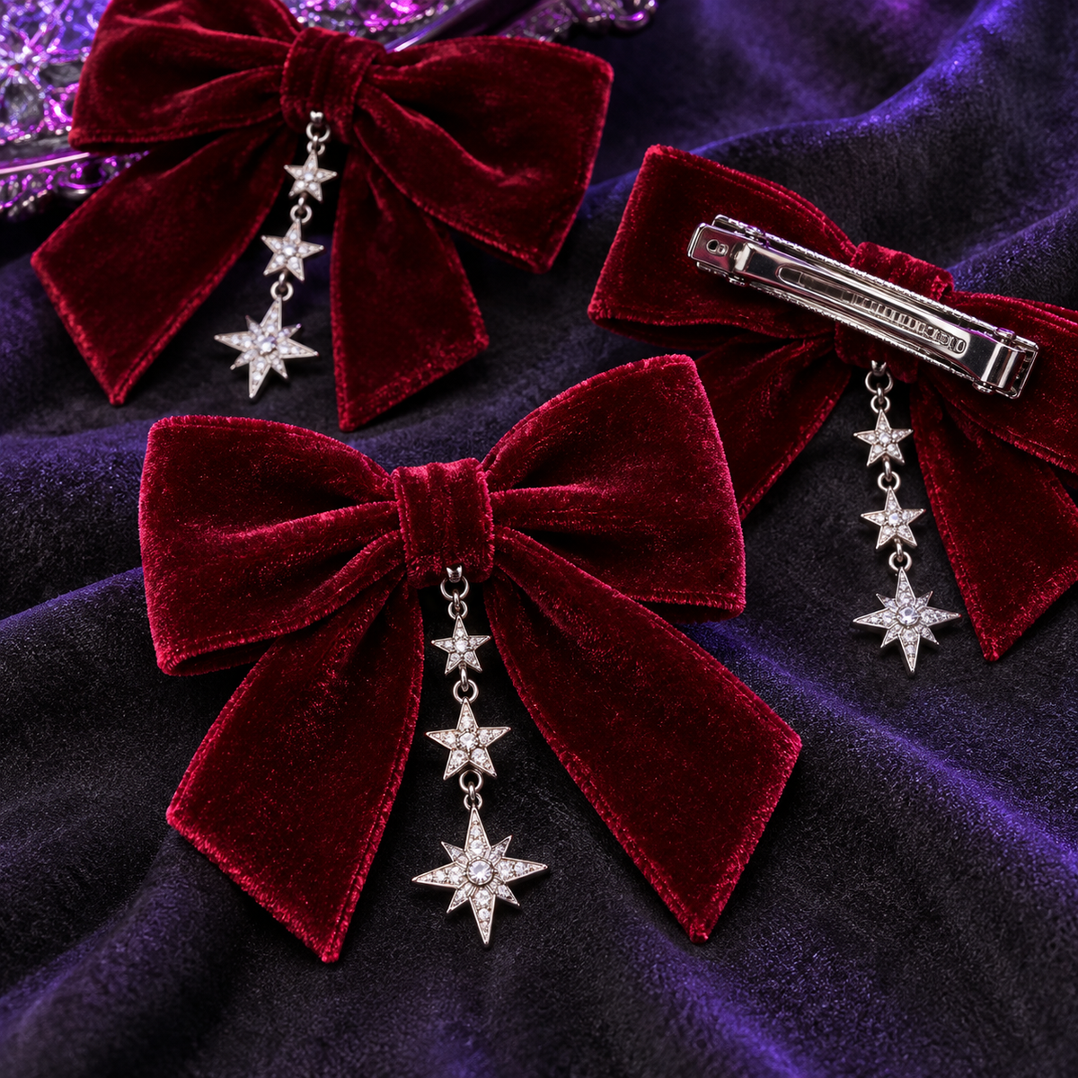 Close-up of velvet bow hair clips, silver stars and metal clasp