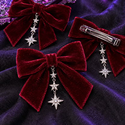 Close-up of velvet bow hair clips, silver stars and metal clasp