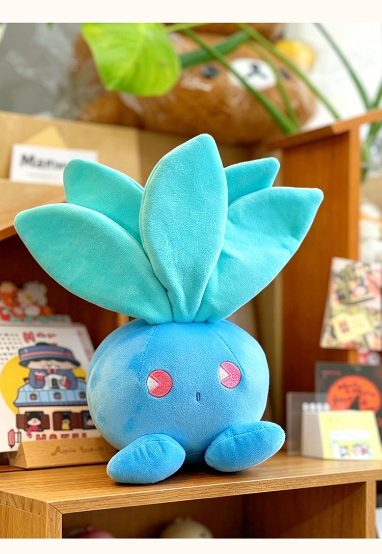 Cute Oddish Plush on a wooden shelf