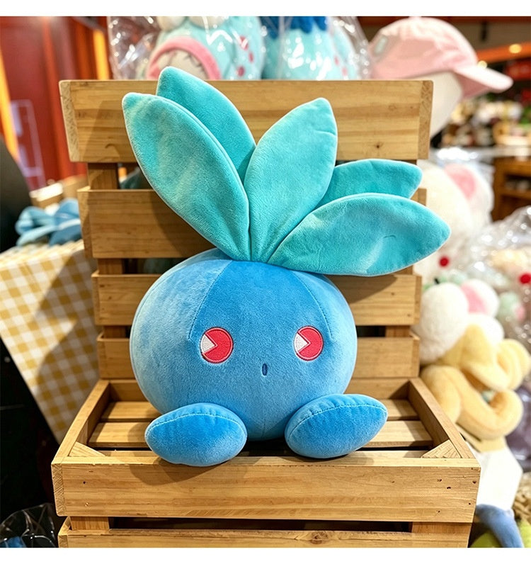Cute Oddish Plush on a wooden crate display