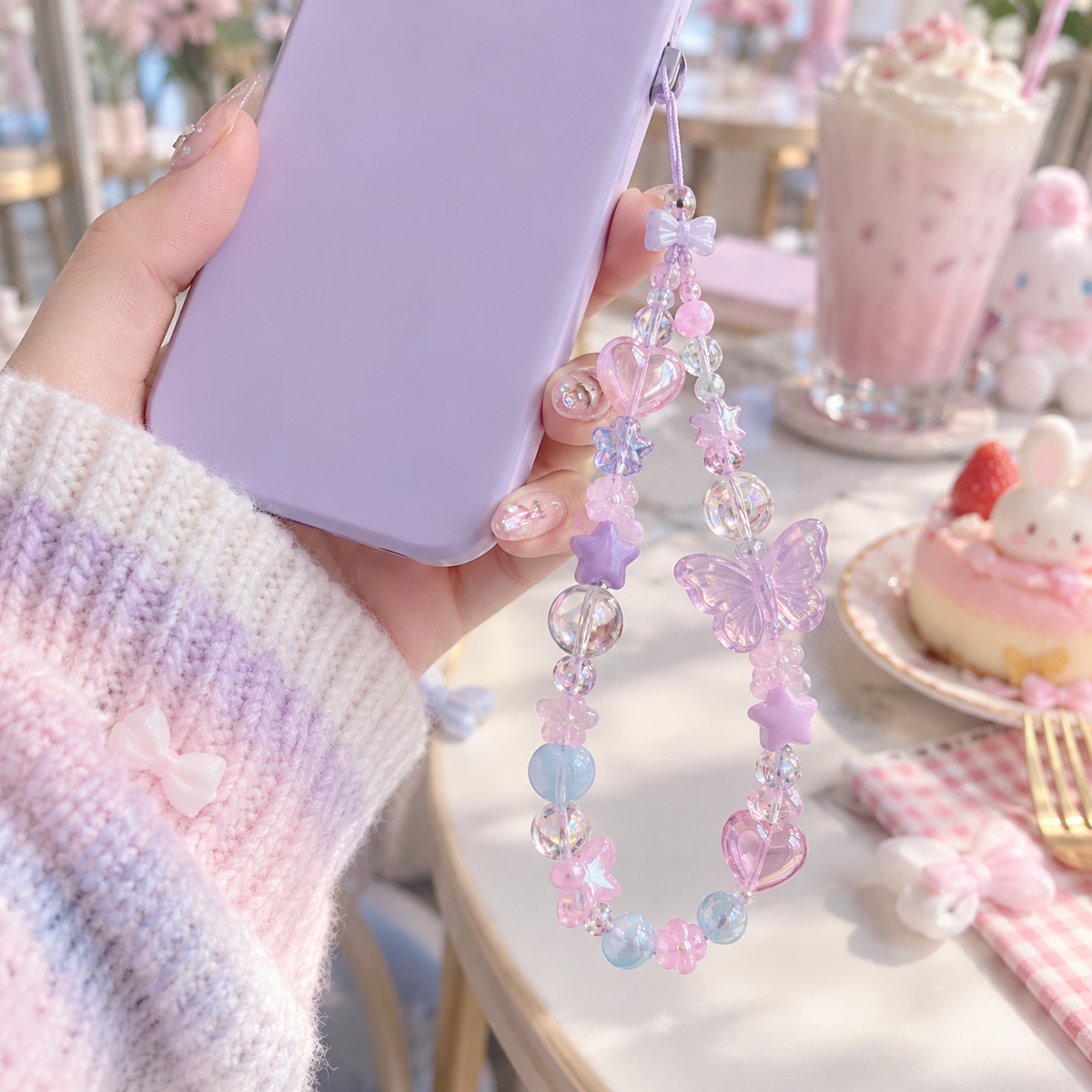 Pastel Harajuku beaded phone charm attached to a lavender phone