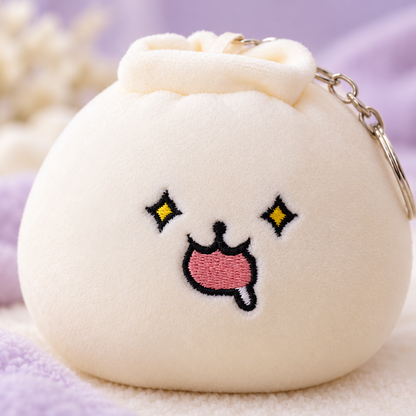 Close-up of the dumpling plush keychain’s yellow star eyes and drooling expression
