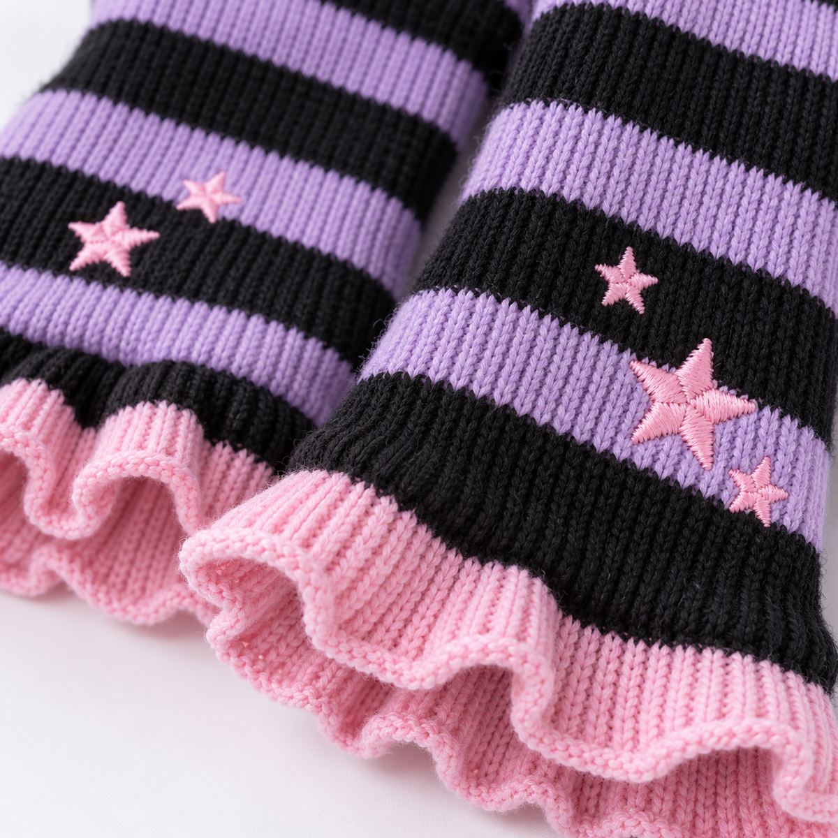 Close detail of striped knit and star embroidery on Harajuku leg warmers