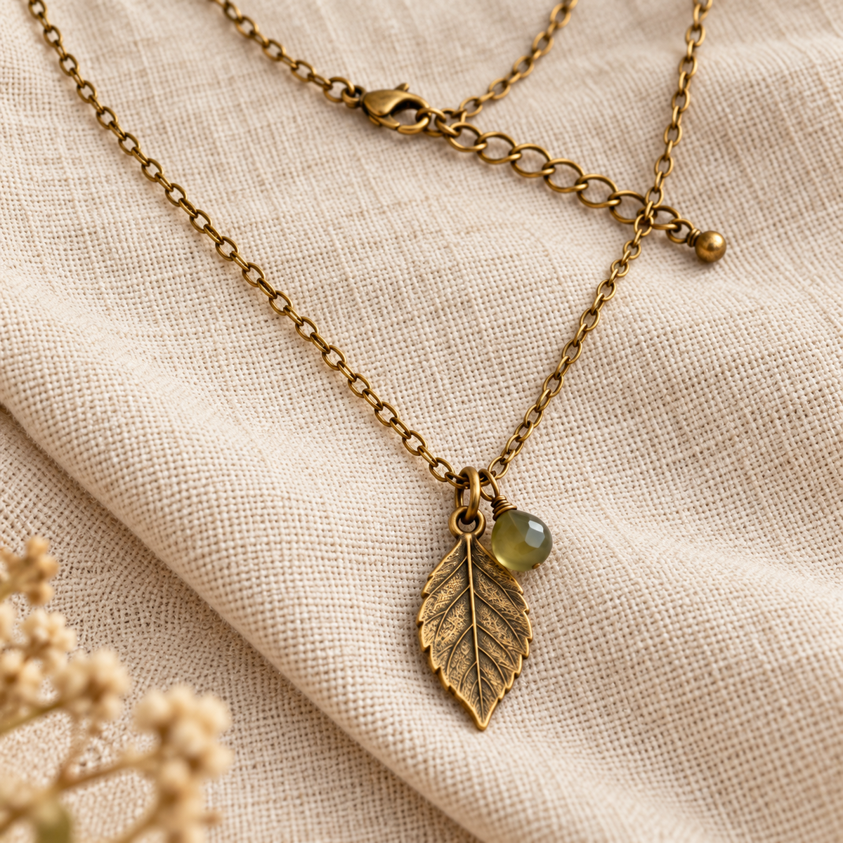 Close-up of leaf pendant and chain detail