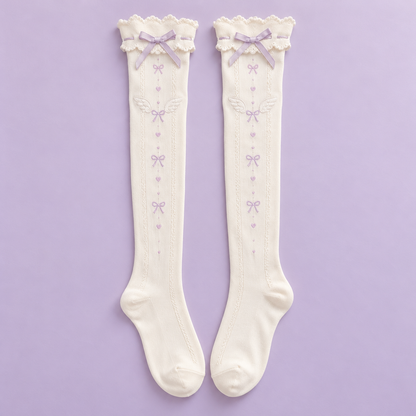 Pair of ivory Tenshi Kawaii over-the-knee socks with lavender bows