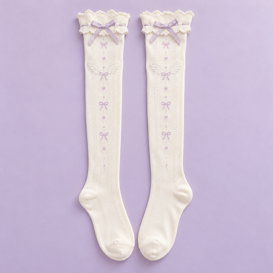 Pair of ivory Tenshi Kawaii over-the-knee socks with lavender bows