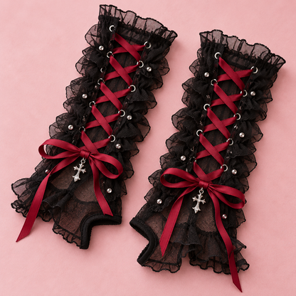 Close-up of crimson ribbon lacing on black mesh arm warmers