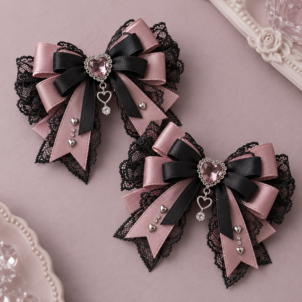 Pair of black and dusty rose Jirai Kei lace hair bows with heart charms