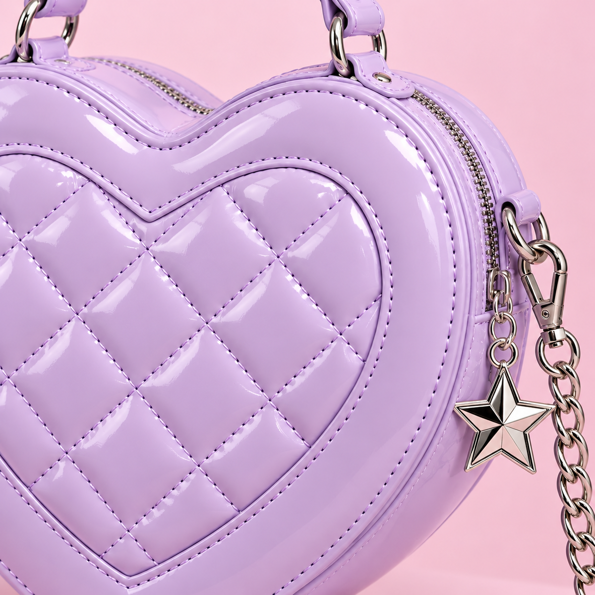 Close-up detail of quilted heart stitching and star charm on lavender bag