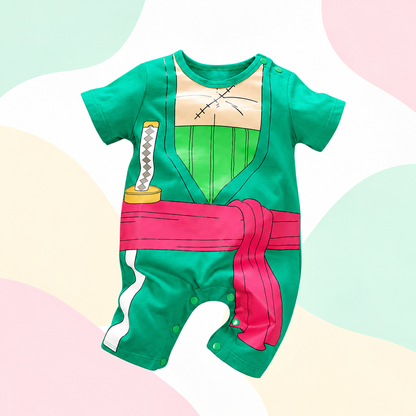 Front view of the Zoro romper in its original bright turquoise green and pink colors on a light pastel background