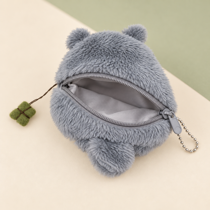 Open Totoro plush keychain wallet showing zipper and lining
