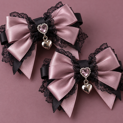 Close-up of Jirai Kei bow clips with lace, heart jewel and silver charm