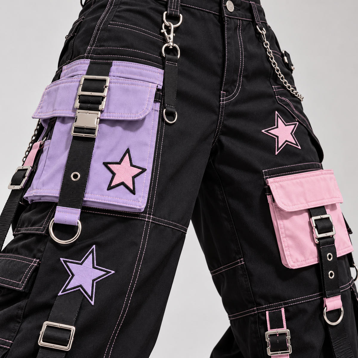 Close detail of pastel cargo pockets, straps, and star patches on Harajuku pants