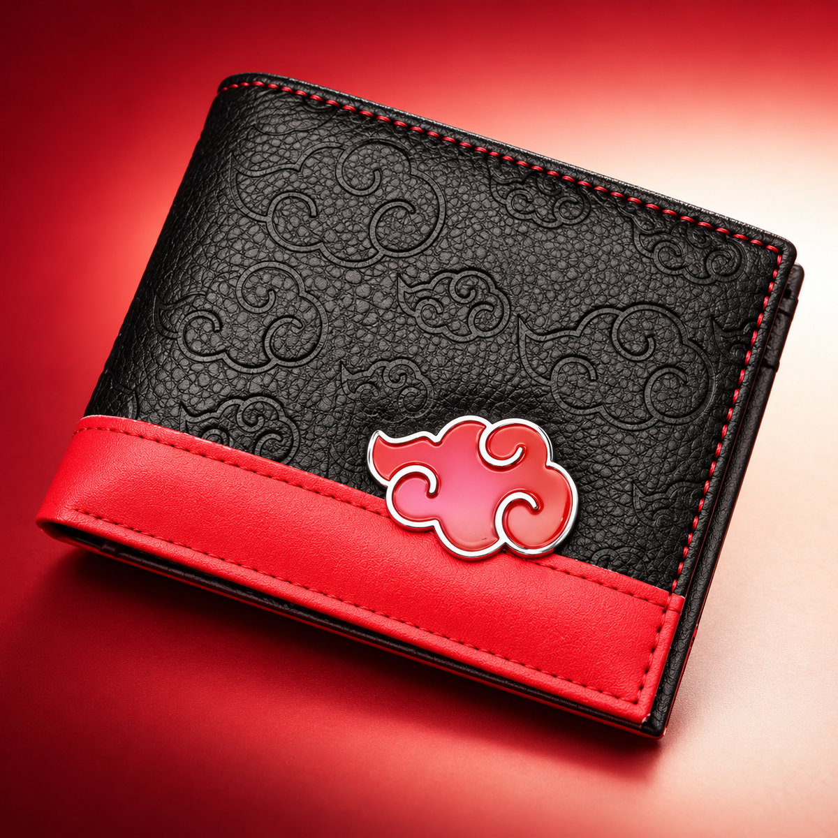Close detail of the Akatsuki Clan wallet's embossed cloud pattern and red trim