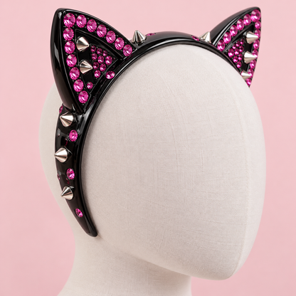 Three-quarter detail of pink rhinestones and silver studs on the black Gyaru cat-ear headband