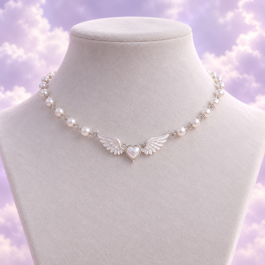 Silver tone pearl choker with a tiny heart framed by angel wings