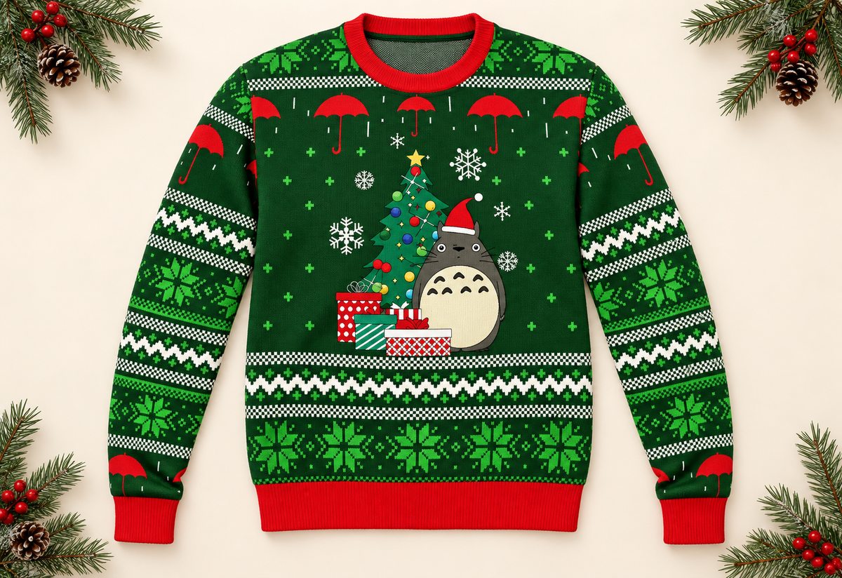 Green forest creature Christmas sweater styled flat lay product photo