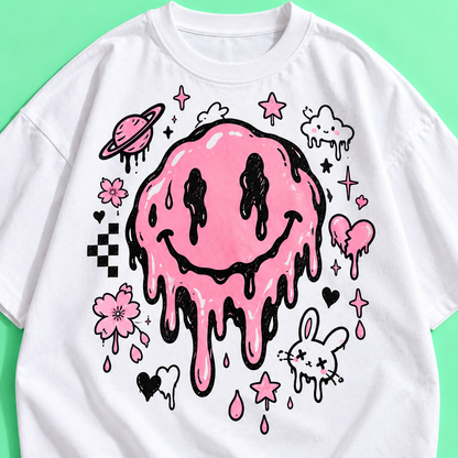 Close-up of pink and black doodle graphic on a white Harajuku shirt