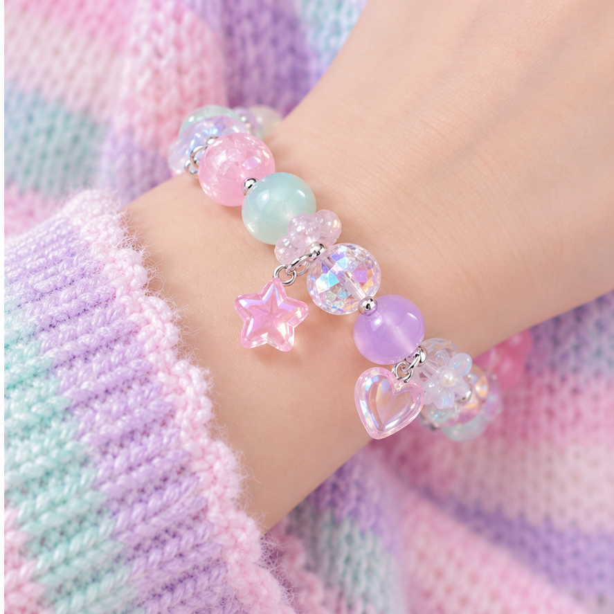 Pastel charm bracelet worn with a Fairy Kei knit sleeve