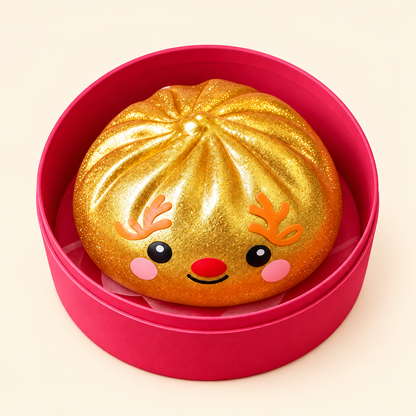 Golden reindeer dumpling squishy nestled in its pink case