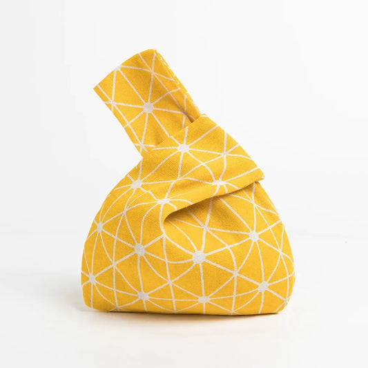 Bolso amarillo con nudo y estampado de Asanoha