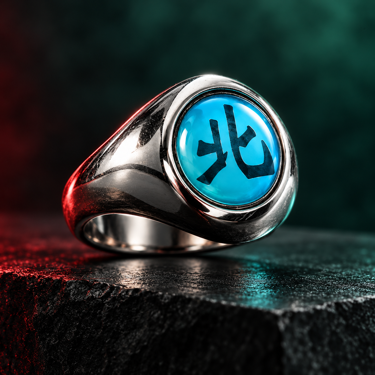 Kakuzu Hoku ring at a low side angle on slate with soft forest-green and cyan light