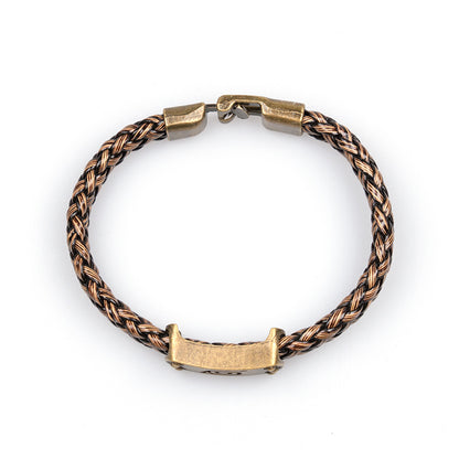 Rear view of the bronze-tone clasp and braided bracelet
