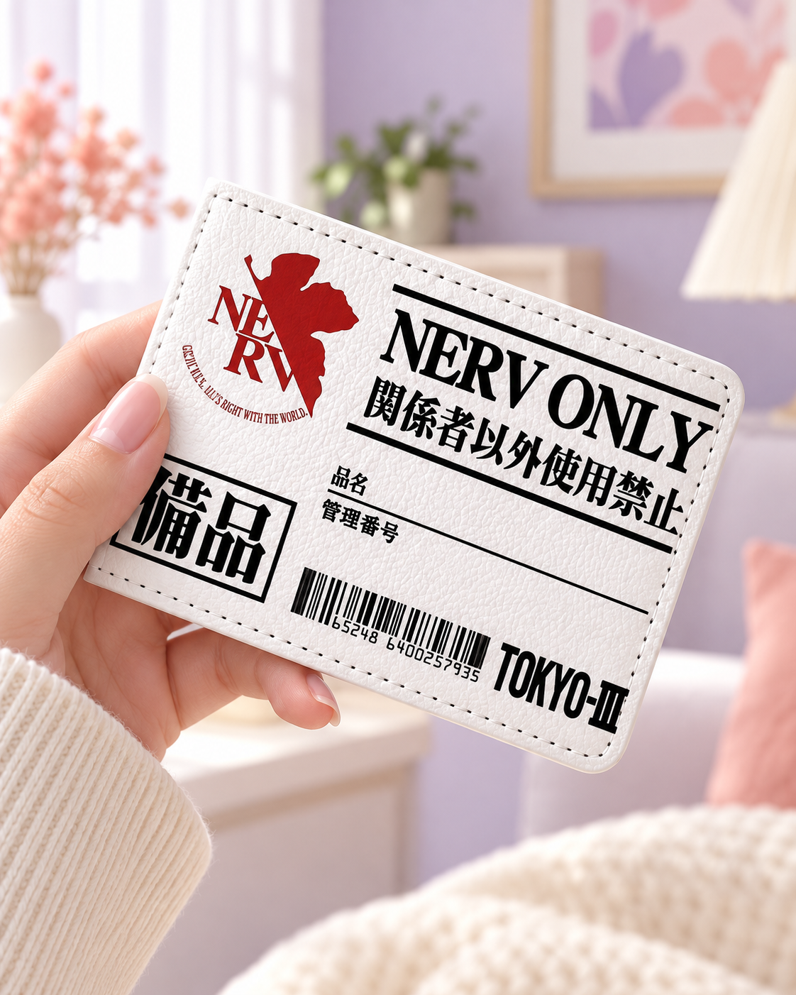 NERV card holder held in hand, angled front view