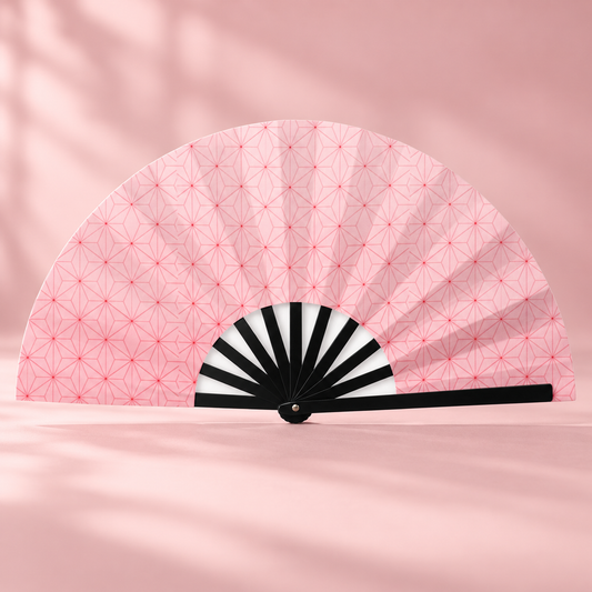 Nezuko-style folding fan displayed against a blush pink backdrop