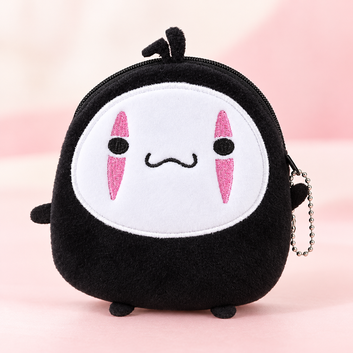 No Face plush wallet front view with embroidered white face and pink markings
