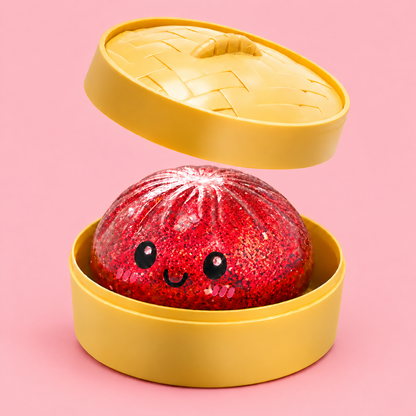 Red Glitter Dumpling Squishy in its case on a plain rose red pastel background