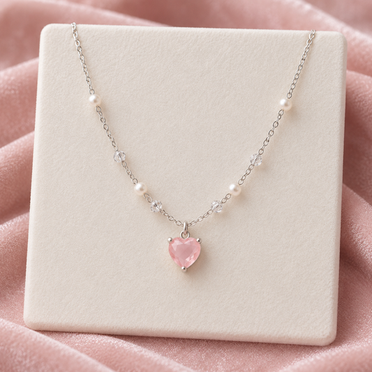 Fine silver-tone necklace with pale pink heart pendant and pearl accents