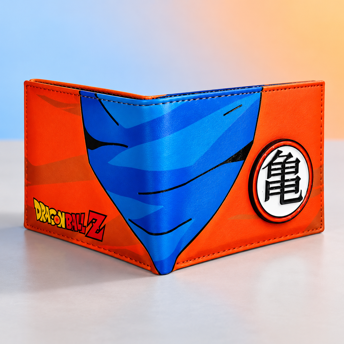 Angled Saiyan Kanji wallet showing its bifold fold, orange panels and blue Goku artwork