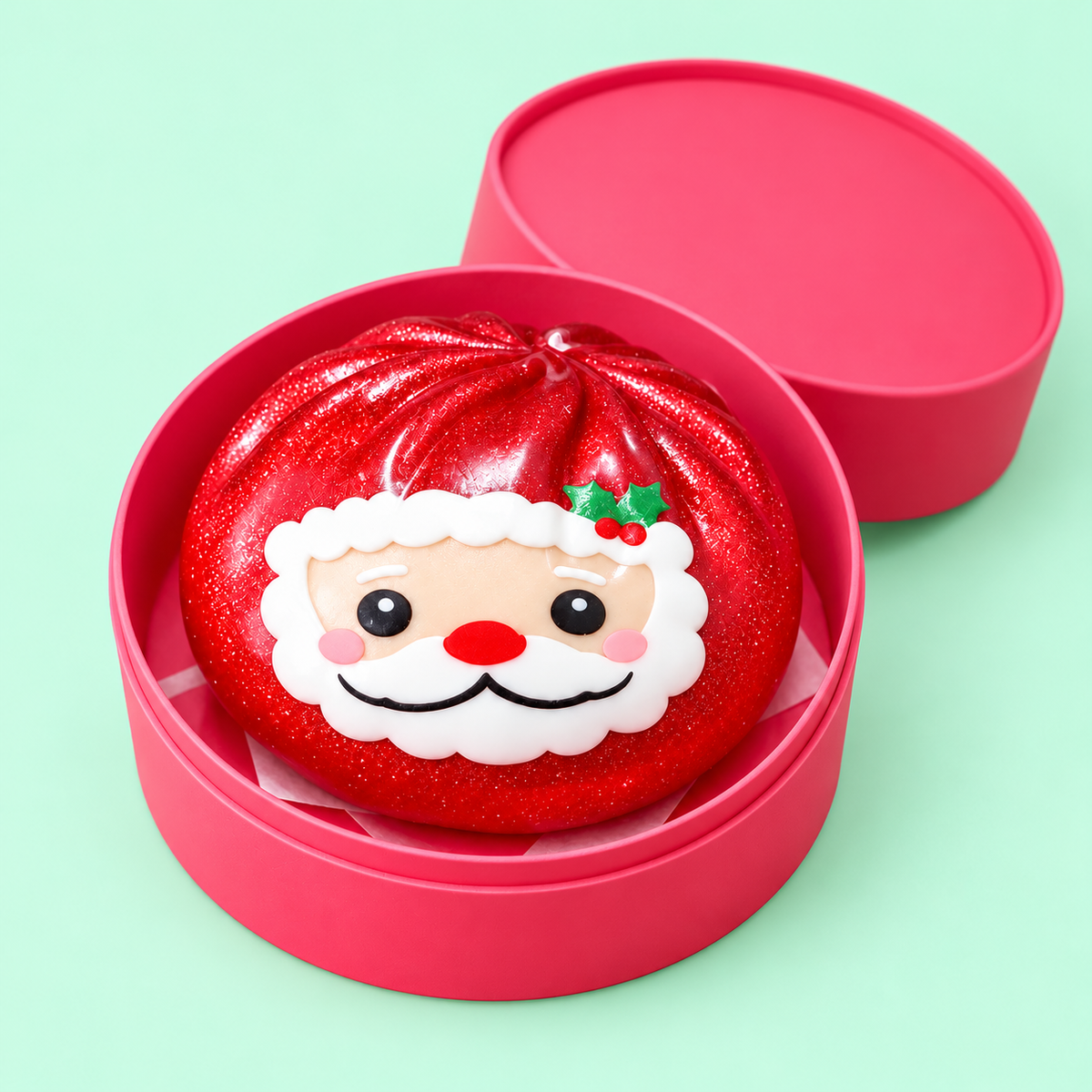 Santa Dumpling Squishy nestled in its pink case