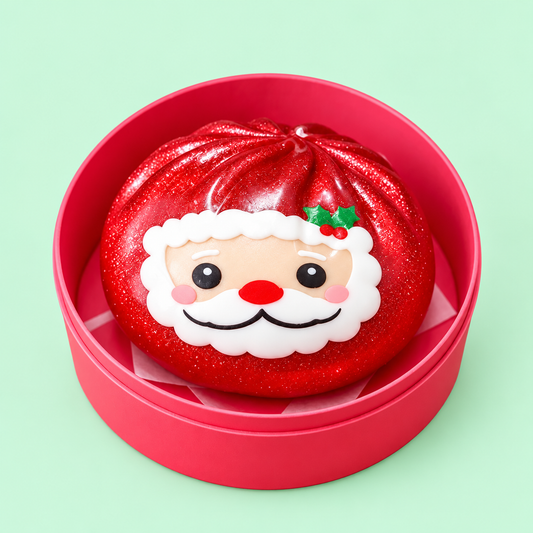 Santa Dumpling Squishy in a matching pink case