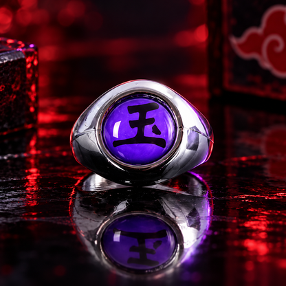 Sasori Gyoku Akatsuki ring with purple 玉 face on a crimson and violet reflective display