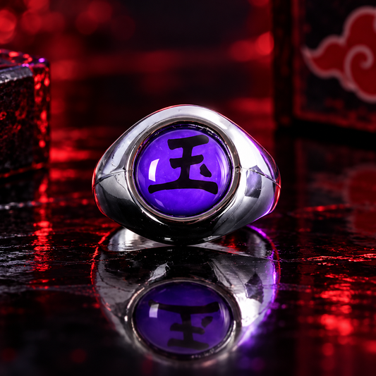 Sasori Gyoku Akatsuki ring with purple 玉 face on a crimson and violet reflective display