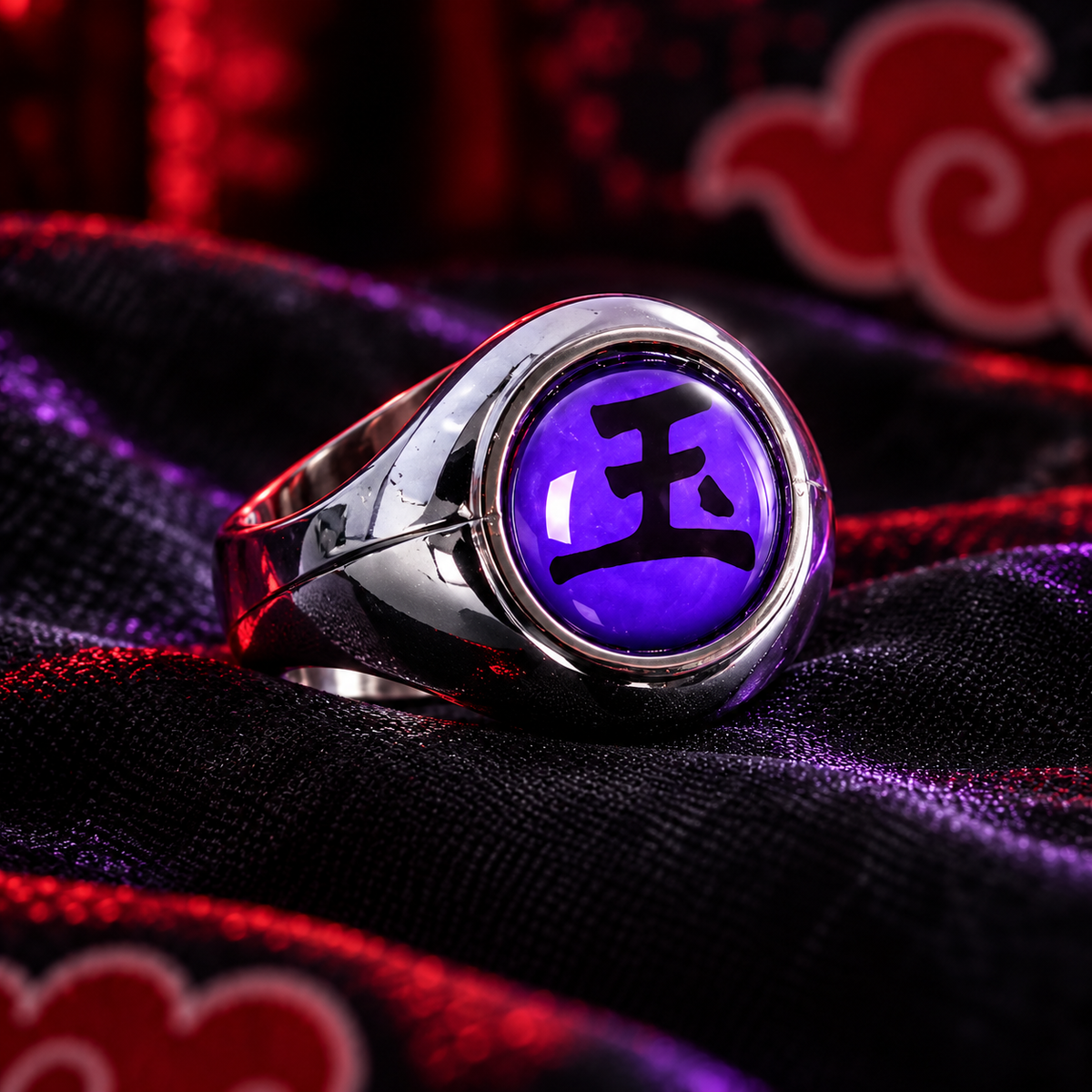 Three-quarter view of Sasori Gyoku ring showing the purple 玉 face and silver-tone band