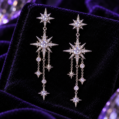 Close-up of starburst earring crystals and dangling silver charms