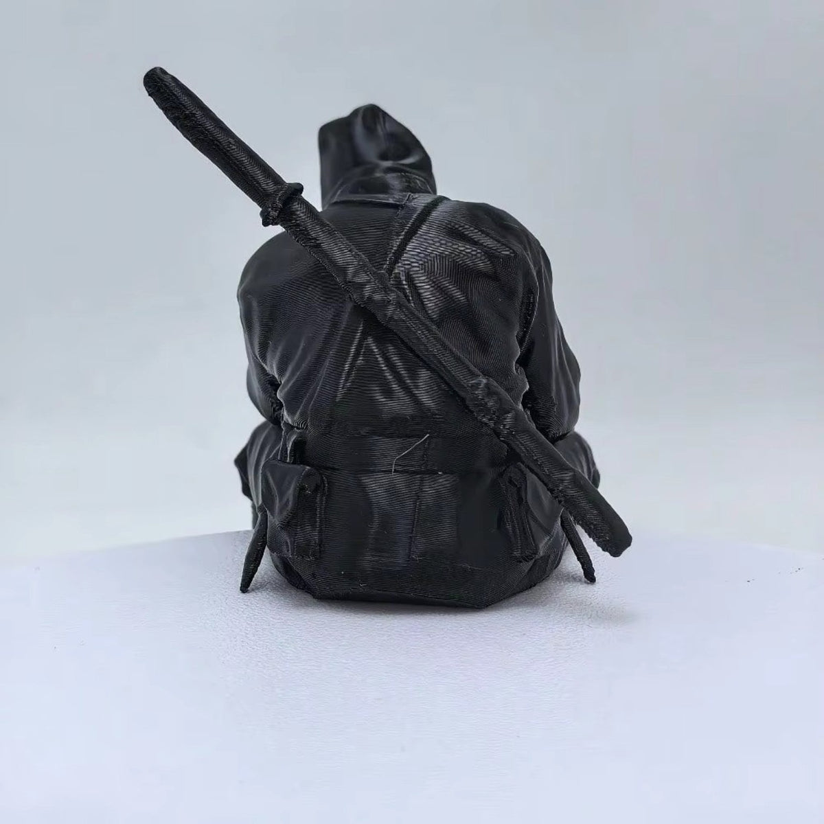 Thinking Ninja figure displayed on a white ledge